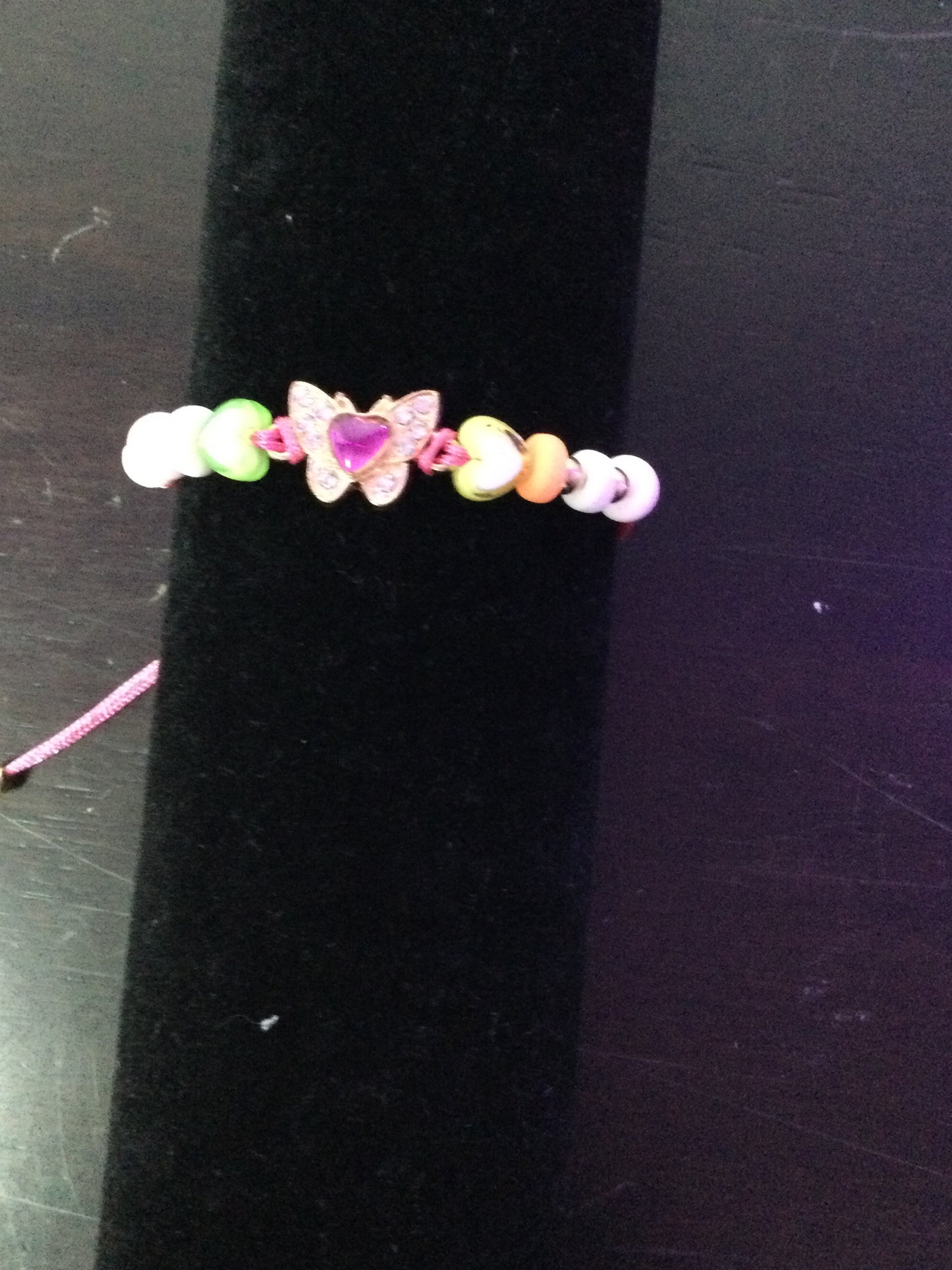 Pink butterfly stringed bracelet