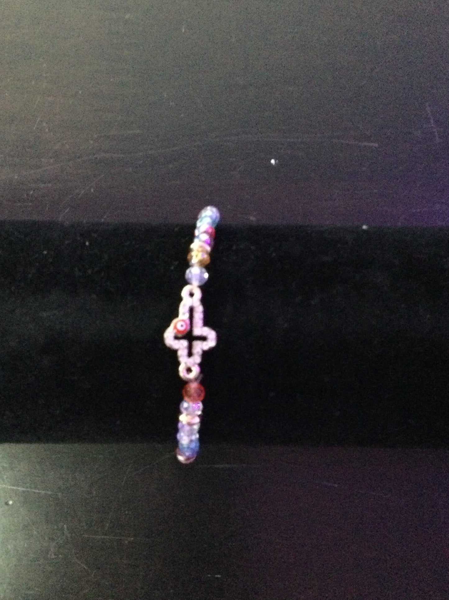 Cross stringed bracelet